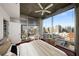 Sun-drenched bedroom boasts city skyline views and balcony access at 943 Peachtree Ne St # 1108, Atlanta, GA 30309