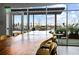 Spacious rooftop communal table with pool view through large windows, perfect for gatherings at 943 Peachtree Ne St # 1108, Atlanta, GA 30309