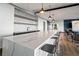 Spacious community kitchen with a long marble counter, modern fixtures, and stylish lighting at 943 Peachtree Ne St # 1108, Atlanta, GA 30309