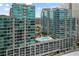 Modern high-rise condo building with a rooftop swimming pool and parking garage at 943 Peachtree Ne St # 1108, Atlanta, GA 30309