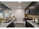 Well-equipped kitchen with stainless steel appliances, granite counters, and modern fixtures at 943 Peachtree Ne St # 1108, Atlanta, GA 30309
