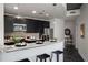 Modern kitchen featuring a breakfast bar with granite countertop and stainless steel appliances at 943 Peachtree Ne St # 1108, Atlanta, GA 30309