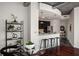 Modern kitchen featuring a breakfast bar with granite countertop and stainless steel appliances at 943 Peachtree Ne St # 1108, Atlanta, GA 30309