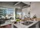 Modern kitchen featuring granite countertops, stainless steel sink, and city views at 943 Peachtree Ne St # 1108, Atlanta, GA 30309