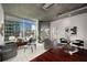 Modern living room with floor-to-ceiling windows offering panoramic city views and ample natural light at 943 Peachtree Ne St # 1108, Atlanta, GA 30309