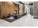 Grand lobby features modern seating, stylish decor, wood paneling, marble floors and columns with abstract art at 943 Peachtree Ne St # 1108, Atlanta, GA 30309
