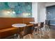 Stylish lounge area featuring a comfortable bench, marble tables, and elegant lighting at 943 Peachtree Ne St # 1108, Atlanta, GA 30309