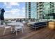 Relaxing rooftop deck with cozy lounge seating and dining areas, perfect for outdoor enjoyment at 943 Peachtree Ne St # 1108, Atlanta, GA 30309