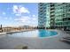 Sparkling community pool surrounded by lounge chairs and landscaping at 943 Peachtree Ne St # 1108, Atlanta, GA 30309