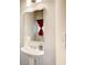 Powder room featuring pedestal sink, chrome faucet, mirror, and light fixture at 10166 Benton Woods Dr, Covington, GA 30014