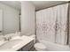Bathroom with a white sink and shower with a patterned curtain at 10166 Benton Woods Dr, Covington, GA 30014