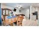 Open-concept dining area featuring wood-look flooring, furniture, and lighting at 10166 Benton Woods Dr, Covington, GA 30014