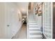 Bright foyer featuring wood-look flooring, staircase, recessed lighting, and neutral paint at 10166 Benton Woods Dr, Covington, GA 30014