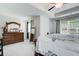 Spacious main bedroom with neutral carpet, a ceiling fan, and ample natural light at 10166 Benton Woods Dr, Covington, GA 30014