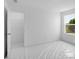 New construction bedroom featuring a large window and walk-in closet at 1420 Windance Lake Dr, Loganville, GA 30052