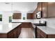 Well-lit kitchen featuring stainless steel appliances, granite countertops, and plenty of counter space at 1420 Windance Lake Dr, Loganville, GA 30052