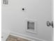 Laundry room features a utility sink hookups, flooring, and crisp white walls at 1420 Windance Lake Dr, Loganville, GA 30052