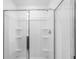 New construction shower featuring built-in shelves and sliding glass doors at 1420 Windance Lake Dr, Loganville, GA 30052