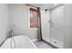 Modern bathroom with a freestanding tub, a separate glass-enclosed shower, and a bamboo window shade at 3465 Callie Still Rd, Lawrenceville, GA 30045
