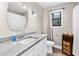 Cozy bathroom featuring a white vanity with granite countertop and ample storage at 3465 Callie Still Rd, Lawrenceville, GA 30045