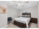 Neutral bedroom featuring a dark wood bed frame, matching nightstands, and a cozy seating chair at 3465 Callie Still Rd, Lawrenceville, GA 30045