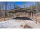 Metal carport with a concrete pad, providing covered parking or storage space at 3465 Callie Still Rd, Lawrenceville, GA 30045