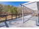 Expansive deck with wooden railings, string lights, and picturesque wooded views at 3465 Callie Still Rd, Lawrenceville, GA 30045