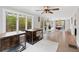 Bright sunroom with lots of windows, neutral walls and ceilings and wood floors at 3465 Callie Still Rd, Lawrenceville, GA 30045