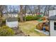 Spacious backyard aerial view featuring a play area, outdoor dining, and gardening beds at 1060 Mclinden Se Ave, Smyrna, GA 30080