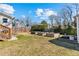 Picture of backyard with gardening beds, a deck, and a playset, perfect for outdoor activities at 1060 Mclinden Se Ave, Smyrna, GA 30080