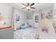 Cozy bedroom with accent wall, play tent, area rug, and ample natural light at 1060 Mclinden Se Ave, Smyrna, GA 30080