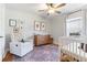 Charming Bedroom featuring a neutral color palette, patterned rug, and natural light at 1060 Mclinden Se Ave, Smyrna, GA 30080