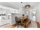 Inviting dining area with hardwood floors, pendant lighting, and a view into the adjacent kitchen at 1060 Mclinden Se Ave, Smyrna, GA 30080