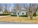 Inviting single-story home featuring a well-manicured front yard and blue door at 1060 Mclinden Se Ave, Smyrna, GA 30080