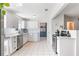 Modern kitchen featuring stainless steel appliances and white cabinetry at 1060 Mclinden Se Ave, Smyrna, GA 30080