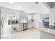 Well-lit kitchen with stainless steel appliances and white cabinets at 1060 Mclinden Se Ave, Smyrna, GA 30080