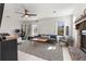 Cozy living room with a fireplace, ample seating, and plenty of natural light at 1060 Mclinden Se Ave, Smyrna, GA 30080