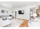 Open living room featuring hardwood floors, a flat screen TV, and comfortable seating at 1060 Mclinden Se Ave, Smyrna, GA 30080