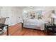 Spacious main bedroom with hard wood floors, dual closets, and neutral decor at 1060 Mclinden Se Ave, Smyrna, GA 30080