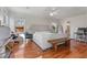 Bright main bedroom with wood floors and natural light, showcasing the desk and seating areas at 1060 Mclinden Se Ave, Smyrna, GA 30080