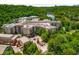 Aerial view of the building surrounded by lush greenery and a river at 200 River Vista Dr # 205, Atlanta, GA 30339