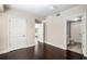 Bedroom featuring dark hardwood floors and a doorway into a bathroom or walk-in closet at 200 River Vista Dr # 205, Atlanta, GA 30339