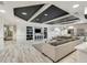 Comfortable common area with stylish furniture, shelving, and a TV at 200 River Vista Dr # 205, Atlanta, GA 30339