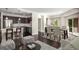 Open living space featuring kitchen with stainless steel appliances and dining area with access to the balcony at 200 River Vista Dr # 205, Atlanta, GA 30339