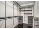 Organized walk-in closet with custom shelving and drawers for optimal storage at 200 River Vista Dr # 205, Atlanta, GA 30339