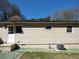 The exterior backyard features siding, a door, an air conditioning unit and several windows offering natural light to the home at 2422 Clarissa Nw Dr, Atlanta, GA 30318