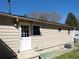 Back exterior view features siding, an air conditioning unit, and a door and windows which bring natural light into the home at 2422 Clarissa Nw Dr, Atlanta, GA 30318