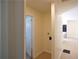 Hallway leading to a laundry area with washer and dryer; features wood-look floors and neutral-colored walls at 2422 Clarissa Nw Dr, Atlanta, GA 30318