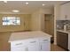 Large kitchen with white cabinets, quartz island, and stainless steel appliances at 2422 Clarissa Nw Dr, Atlanta, GA 30318