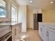 Newly renovated kitchen featuring a stainless steel refrigerator, hardwood floors, and lots of light at 2422 Clarissa Nw Dr, Atlanta, GA 30318